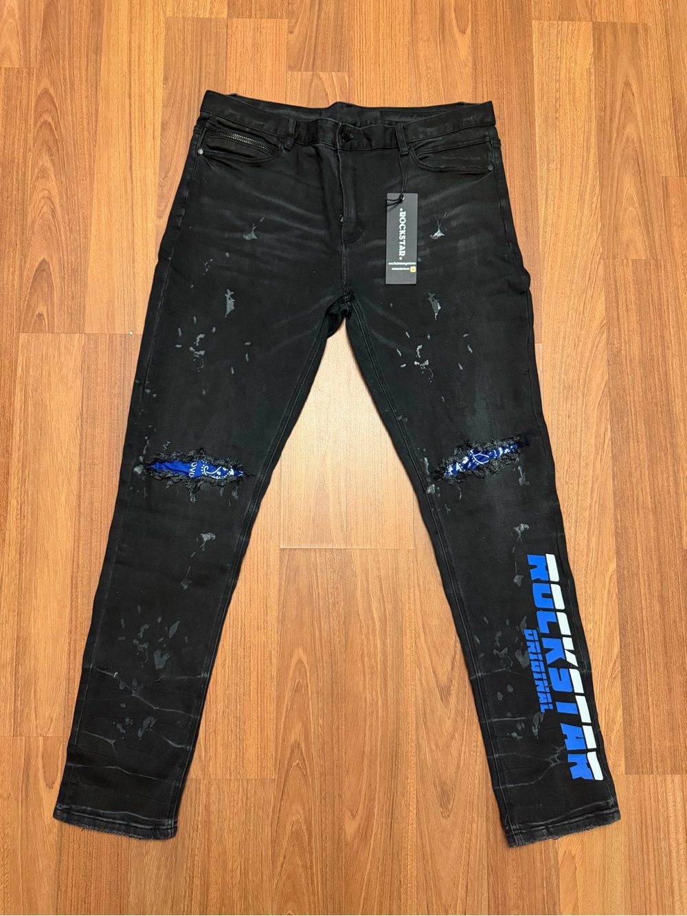 Rockstar Slim Straight Black Jeans with Blue Logo Detailing